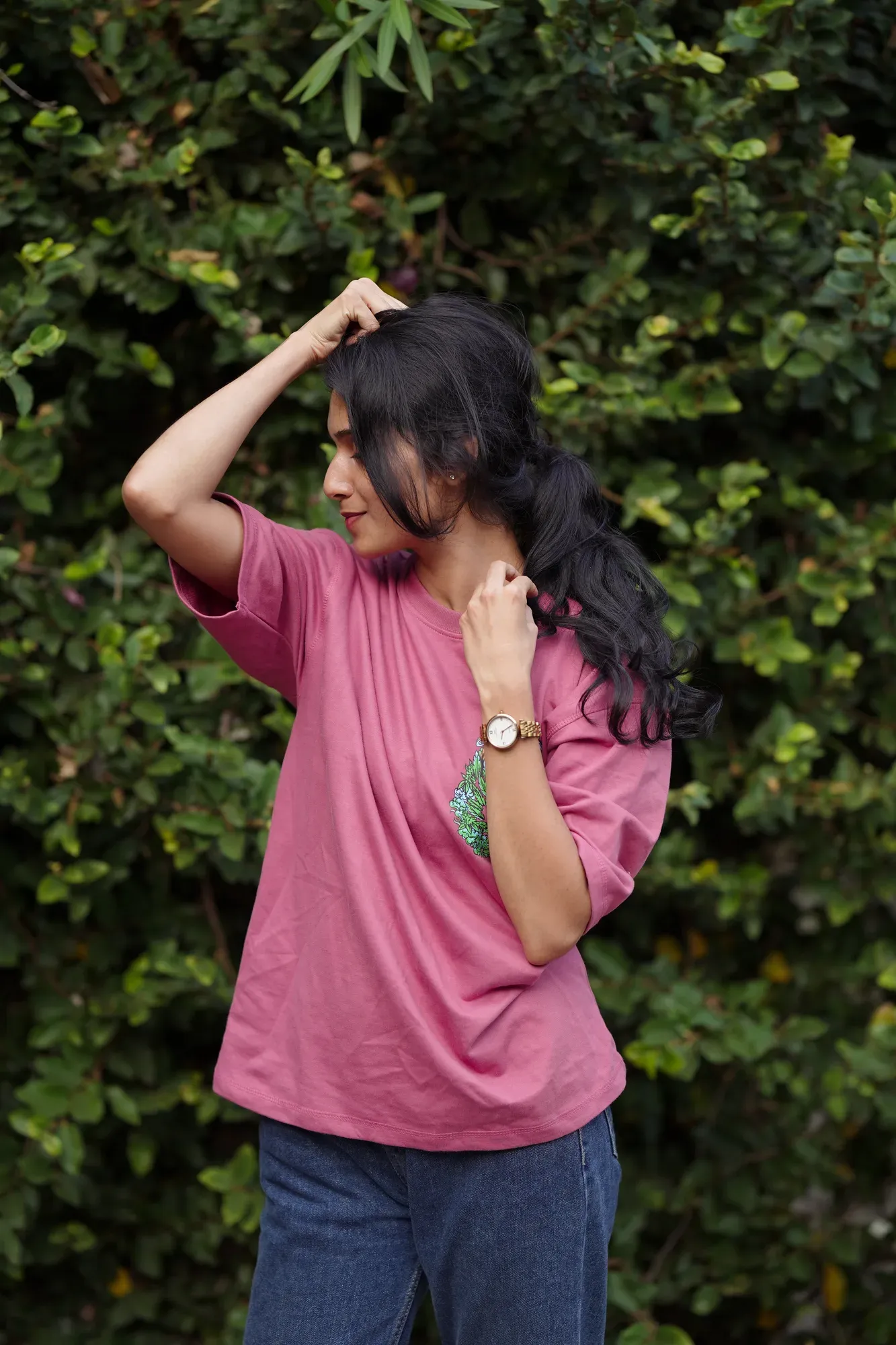 Female model wearing custom pink tee