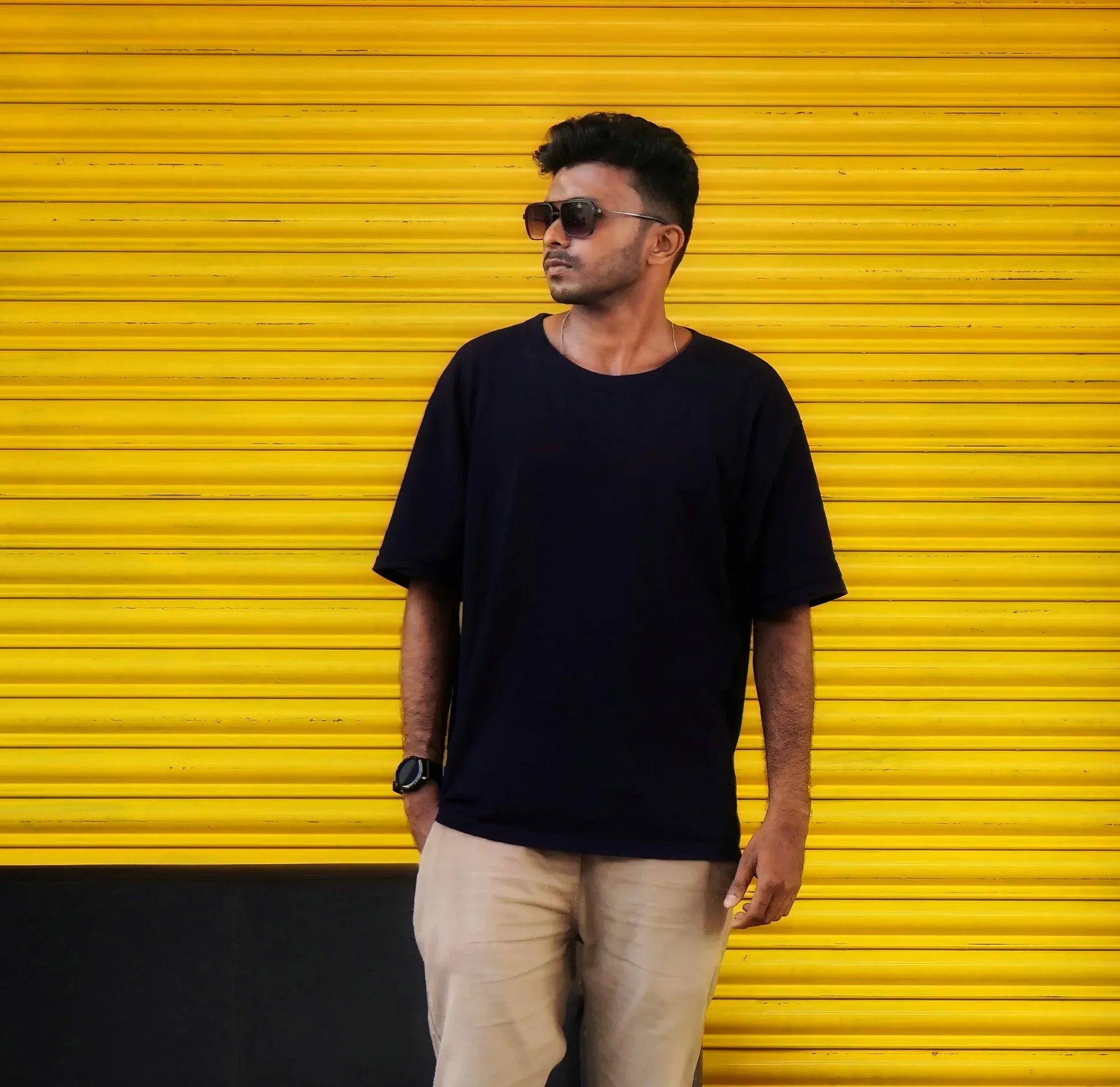 Plain black custom tee on yellow background